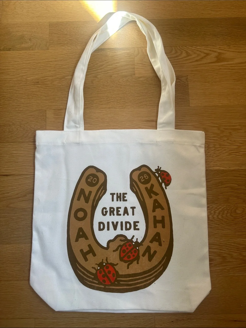 Noah Kahan The Great Divide White Canvas Tote with Horseshoe & Ladybug Graphic